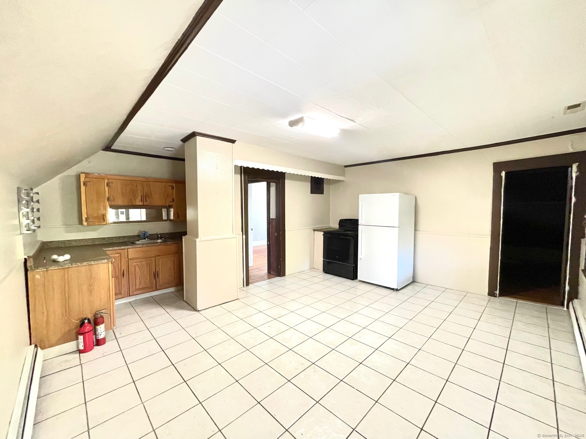 21 Elm Street Ansonia, CT 06401 - Photo 11 of 17 a view of kitchen with refrigerator and window