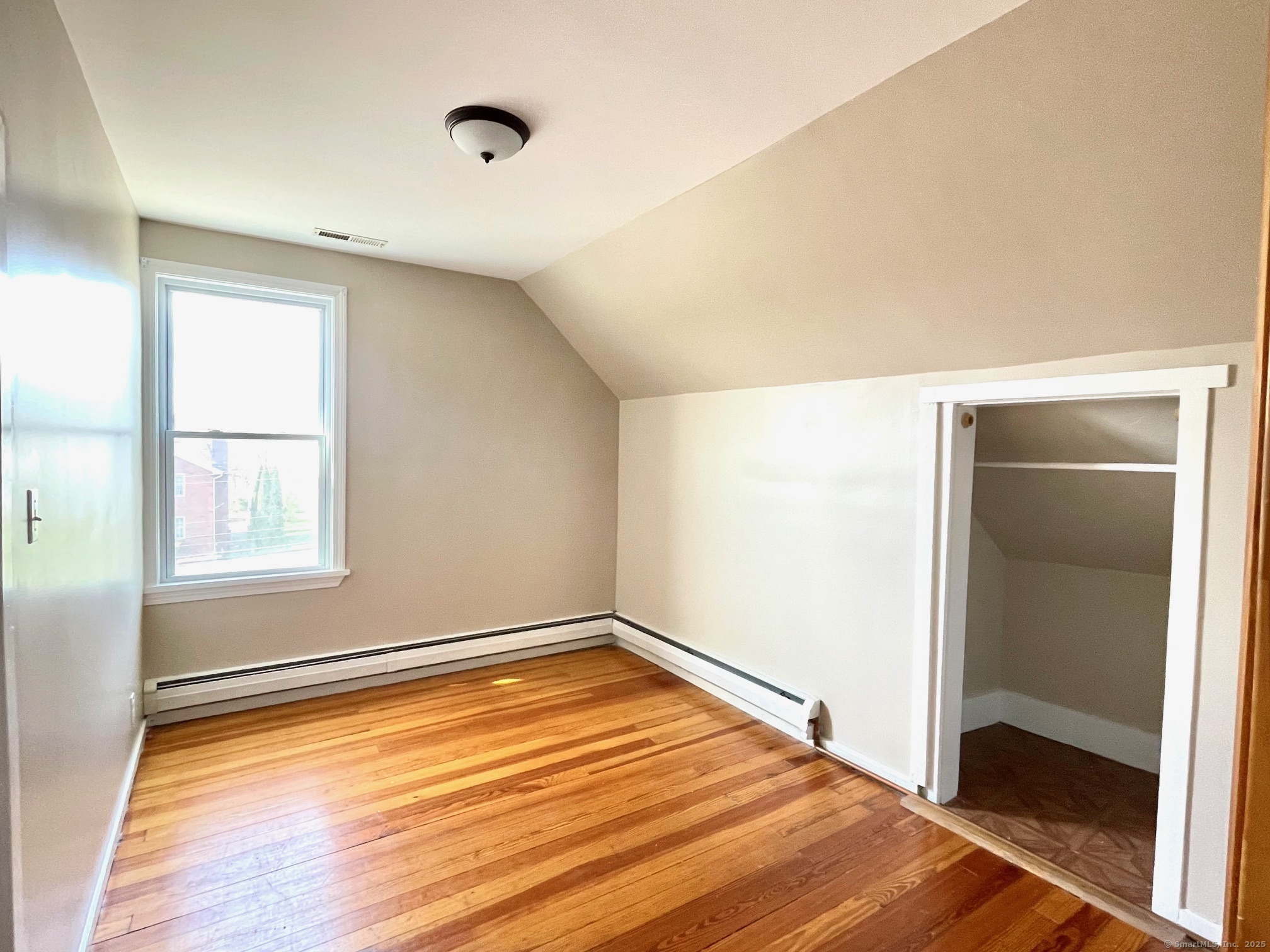21 Elm Street Ansonia, CT 06401 - Photo 12 of 17 a view of empty room with wooden floor