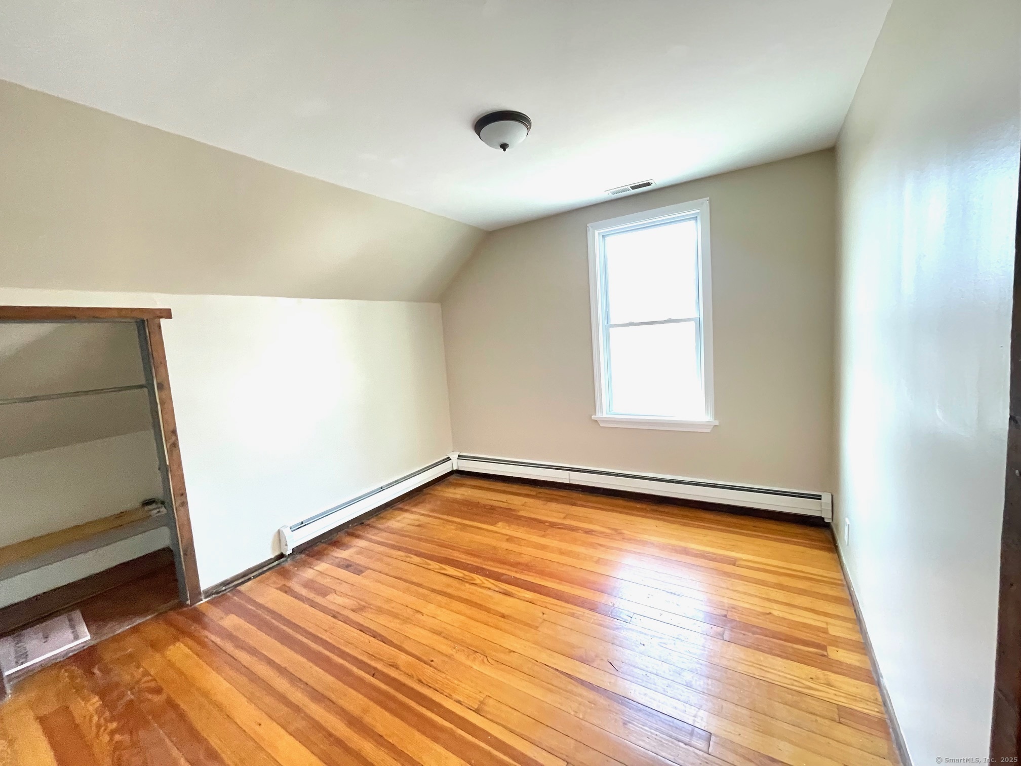 21 Elm Street Ansonia, CT 06401 - Photo 13 of 17 a view of a room with wooden floor and window