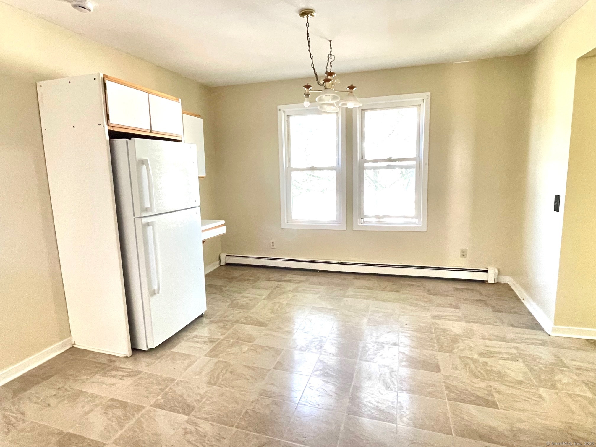 21 Elm Street Ansonia, CT 06401 - Photo 4 of 17 a view of an empty room with a window