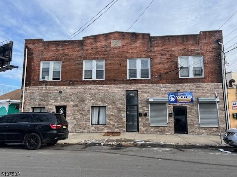 a car parked in front of a brick building