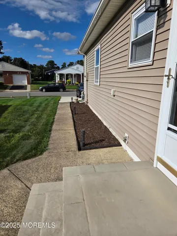 a view of a backyard with sitting area