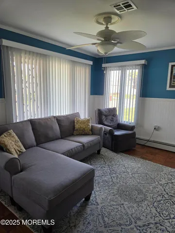 a living room with furniture and a window
