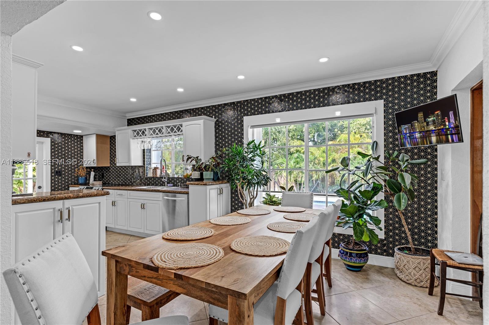 9901 Southwest 35th Terrace Miami, FL 33165 - Photo 25 of 39 a kitchen with a table and chairs in it