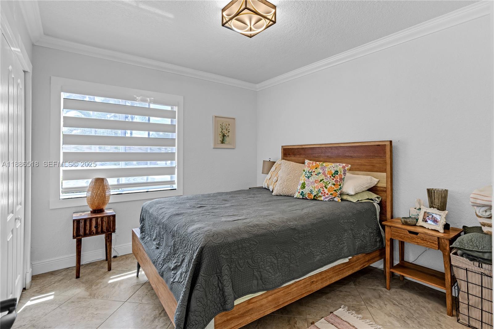 9901 Southwest 35th Terrace Miami, FL 33165 - Photo 36 of 39 a bedroom with a bed and a window