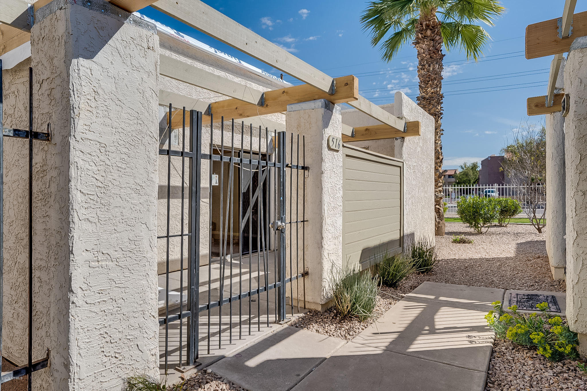 516 South Evergreen Road Tempe, AZ 85288 - Photo 1 of 16 a view of a house with a small yard and potted plants