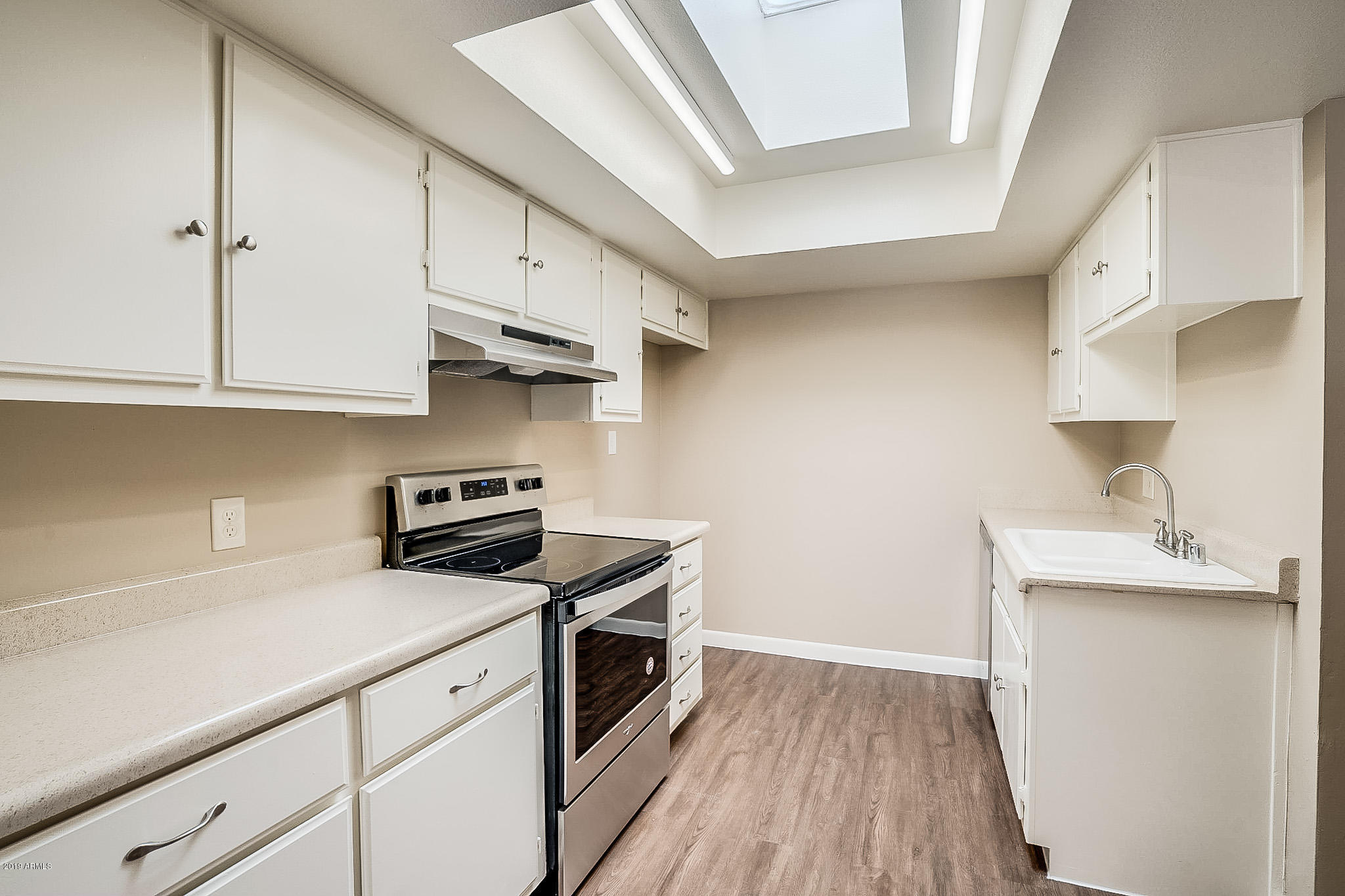 516 South Evergreen Road Tempe, AZ 85288 - Photo 5 of 16 a kitchen with stainless steel appliances granite countertop a sink stove and refrigerator