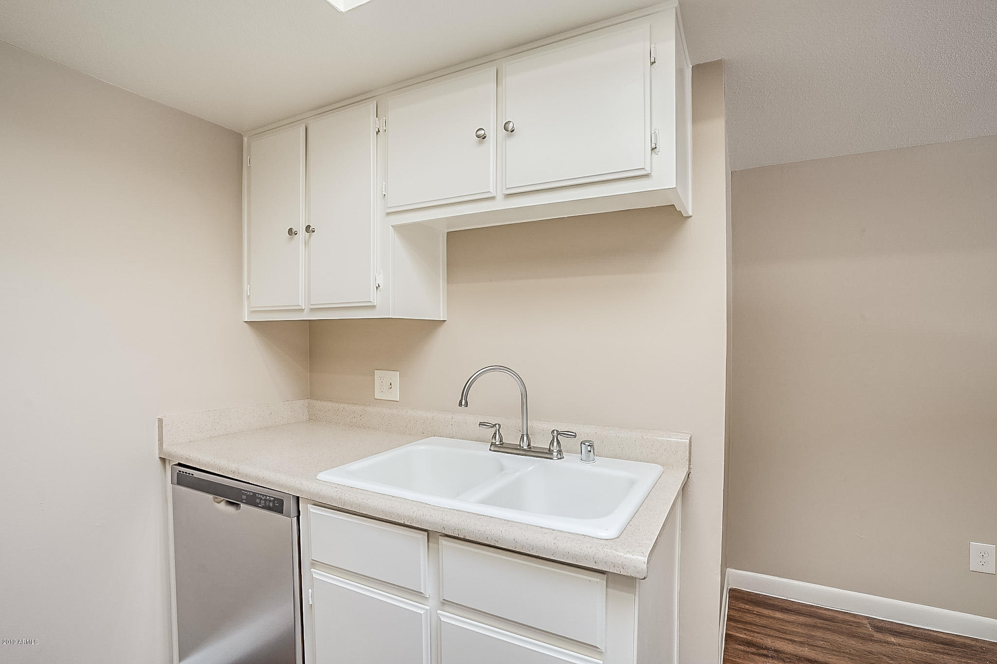 516 South Evergreen Road Tempe, AZ 85288 - Photo 6 of 16 a close view of a sink and cabinets in kitchen