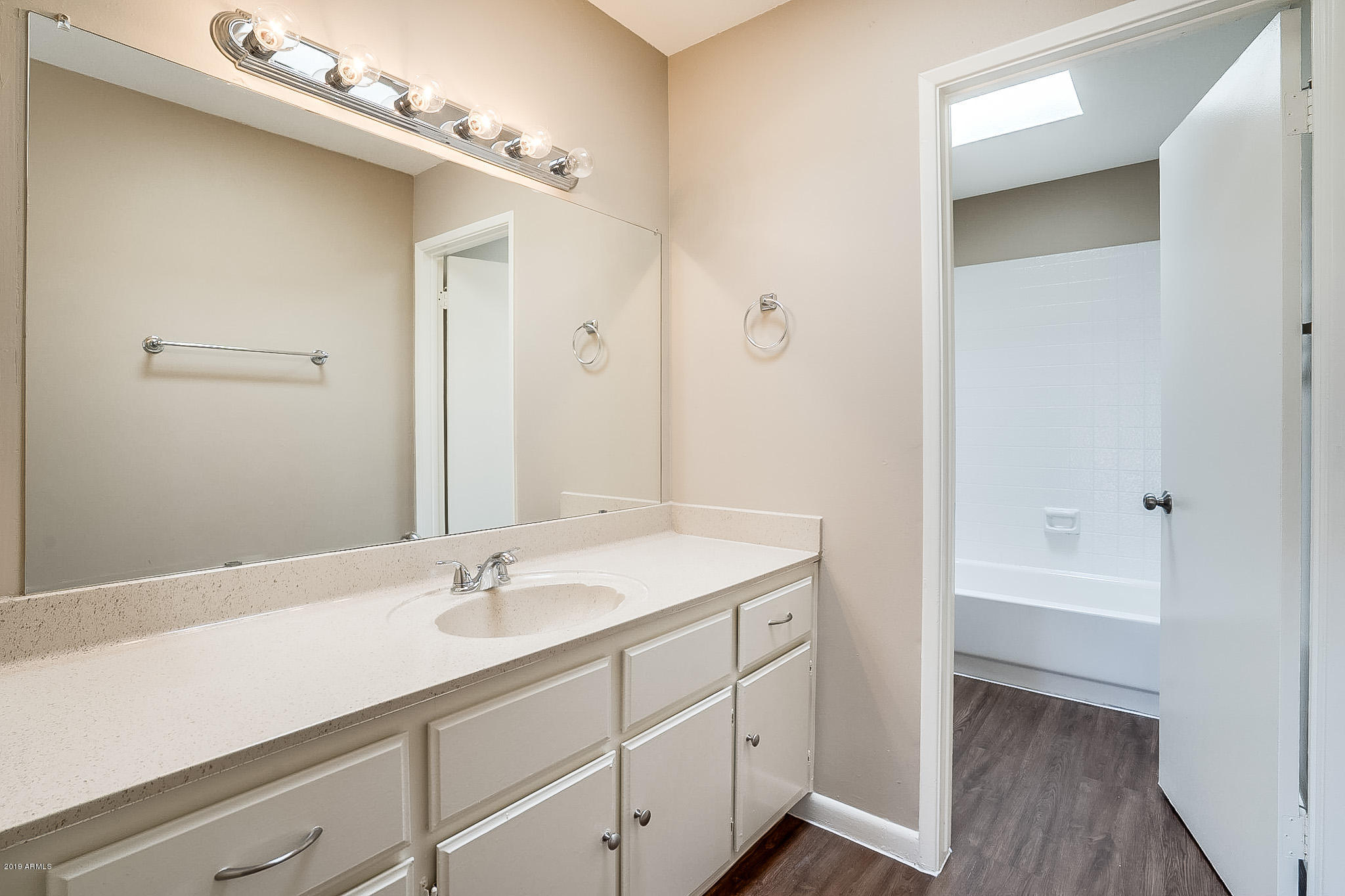 516 South Evergreen Road Tempe, AZ 85288 - Photo 10 of 16 a bathroom with a sink double vanity and a mirror