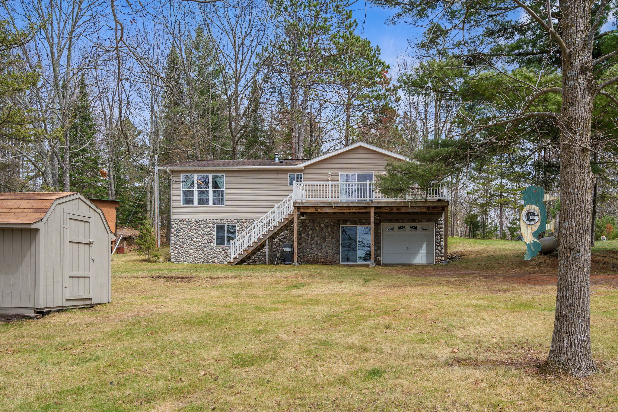 12503 Small Road Hayward, WI 54843 - Photo 1 of 36 Meticulous 1344 sq ft, 2 bedroom home with sunroom/3rd bedroom and unfinished walkout on Nelson Lake.