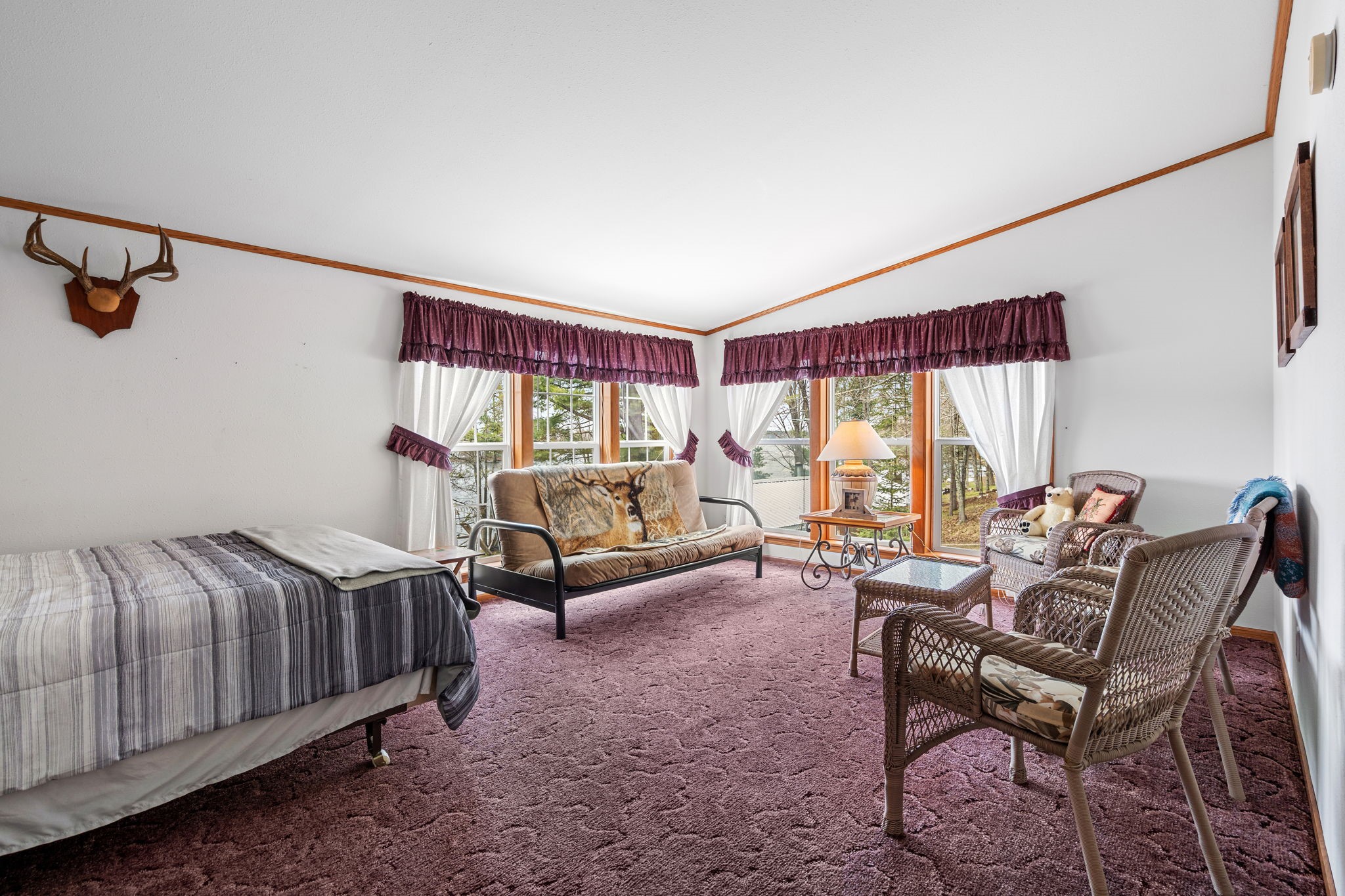 12503 Small Road Hayward, WI 54843 - Photo 20 of 36 Sunroom is being used as a 3rd bedroom with beautiful lake views.