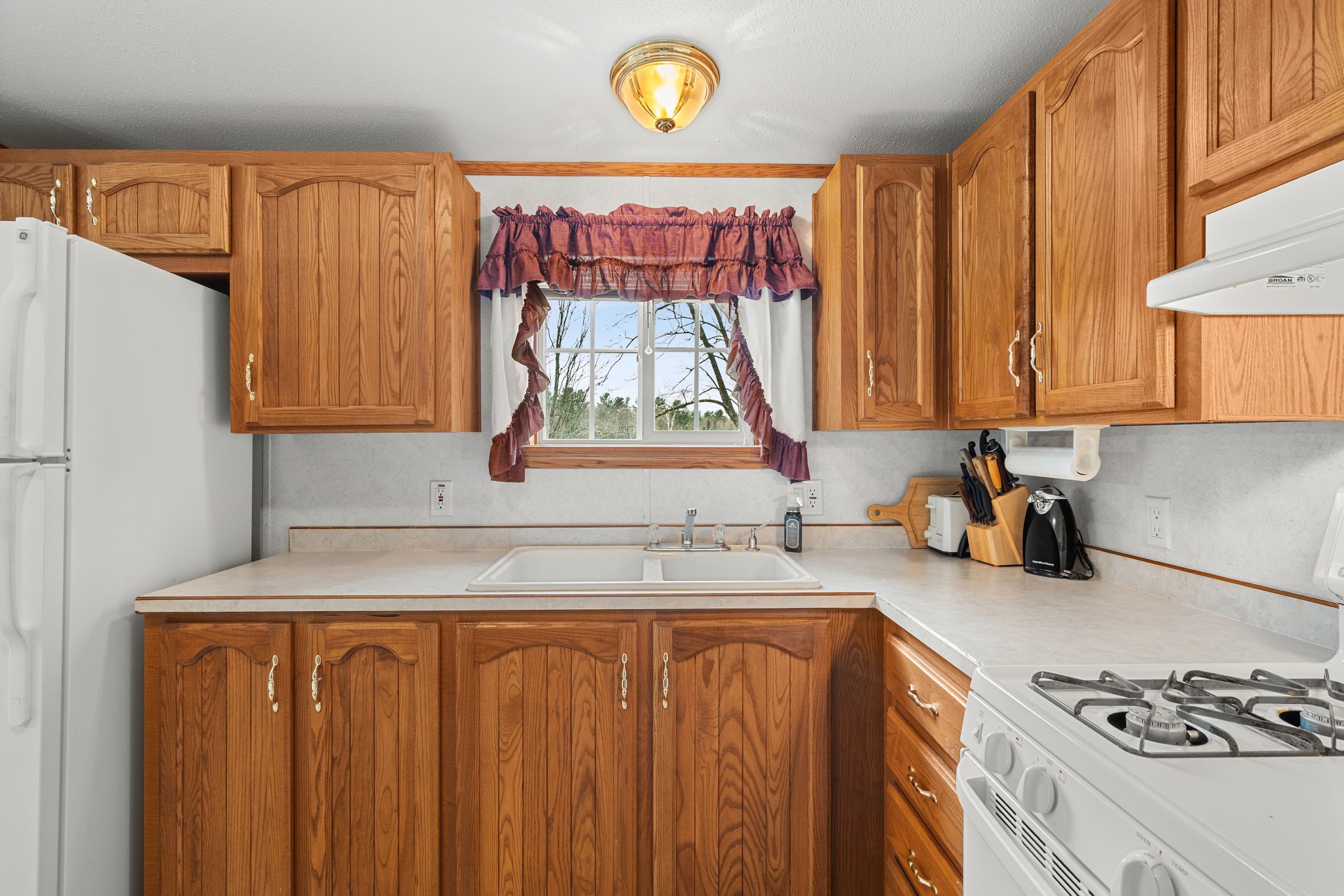 12503 Small Road Hayward, WI 54843 - Photo 24 of 36 Enjoy the lake views while cleaning up or making breakfast.
