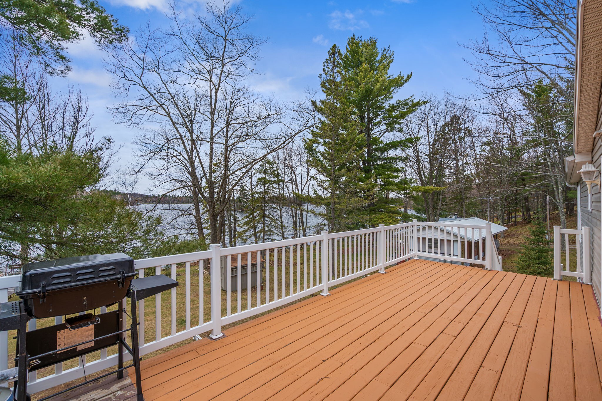 12503 Small Road Hayward, WI 54843 - Photo 26 of 36 Tend the BBQ while enjoying a cocktail on the expansive deck while taking in the gorgeous views.