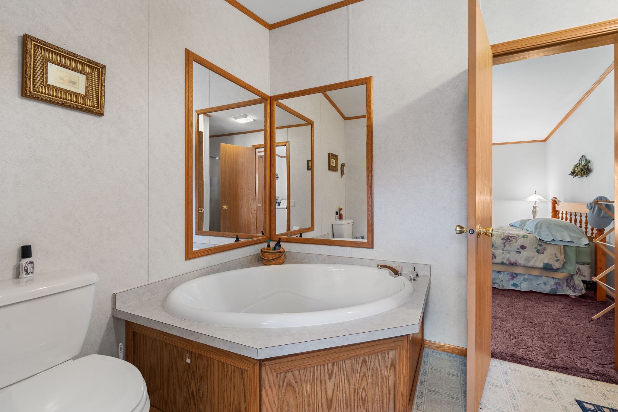 12503 Small Road Hayward, WI 54843 - Photo 30 of 36 Main floor full bathroom has separate shower and soaking tub. Leads into the laundry room and master bedroom.