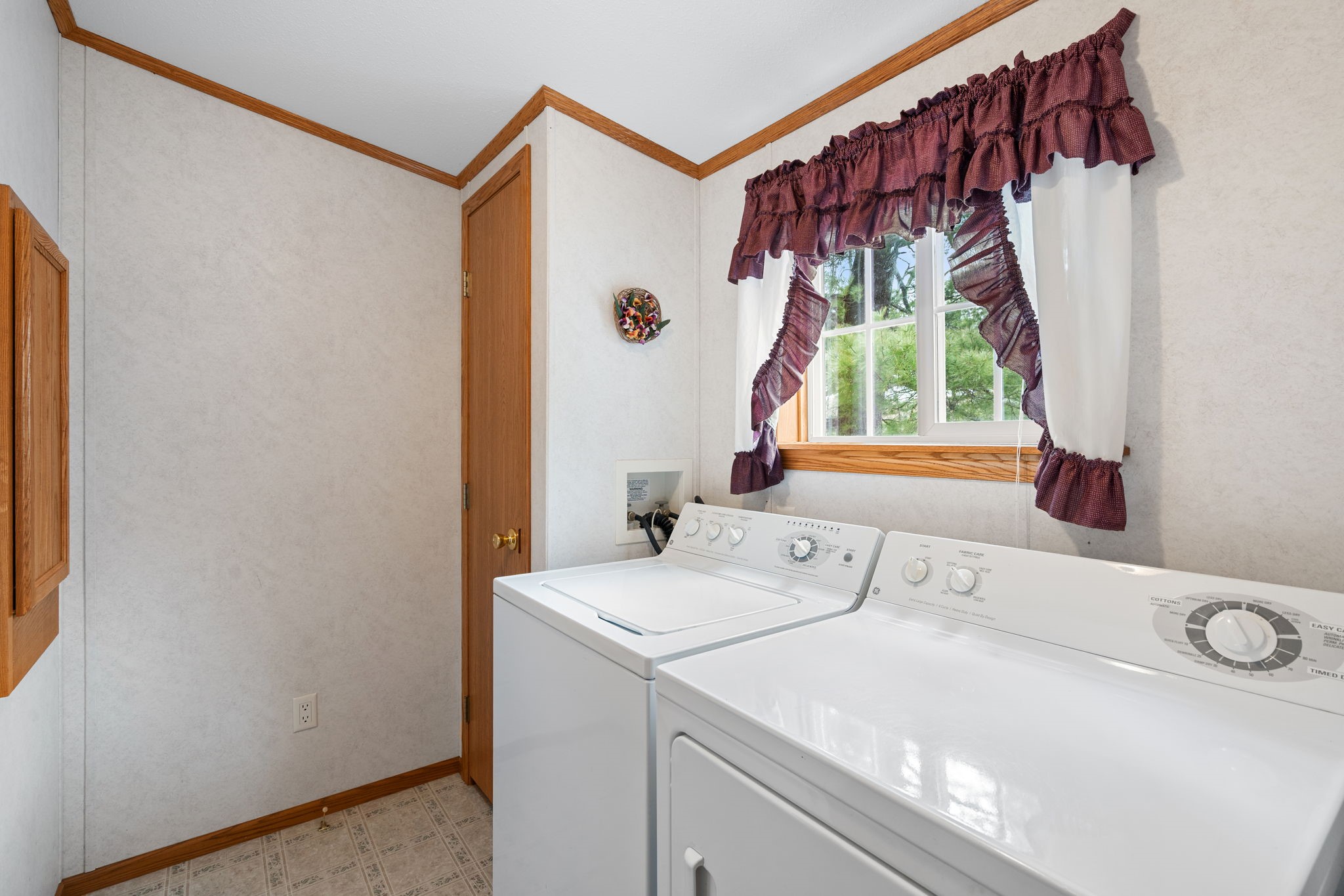 12503 Small Road Hayward, WI 54843 - Photo 32 of 36 Main Floor Laundry room to include electric panel, broom closet, and water heater. W/D are optional for purchase.