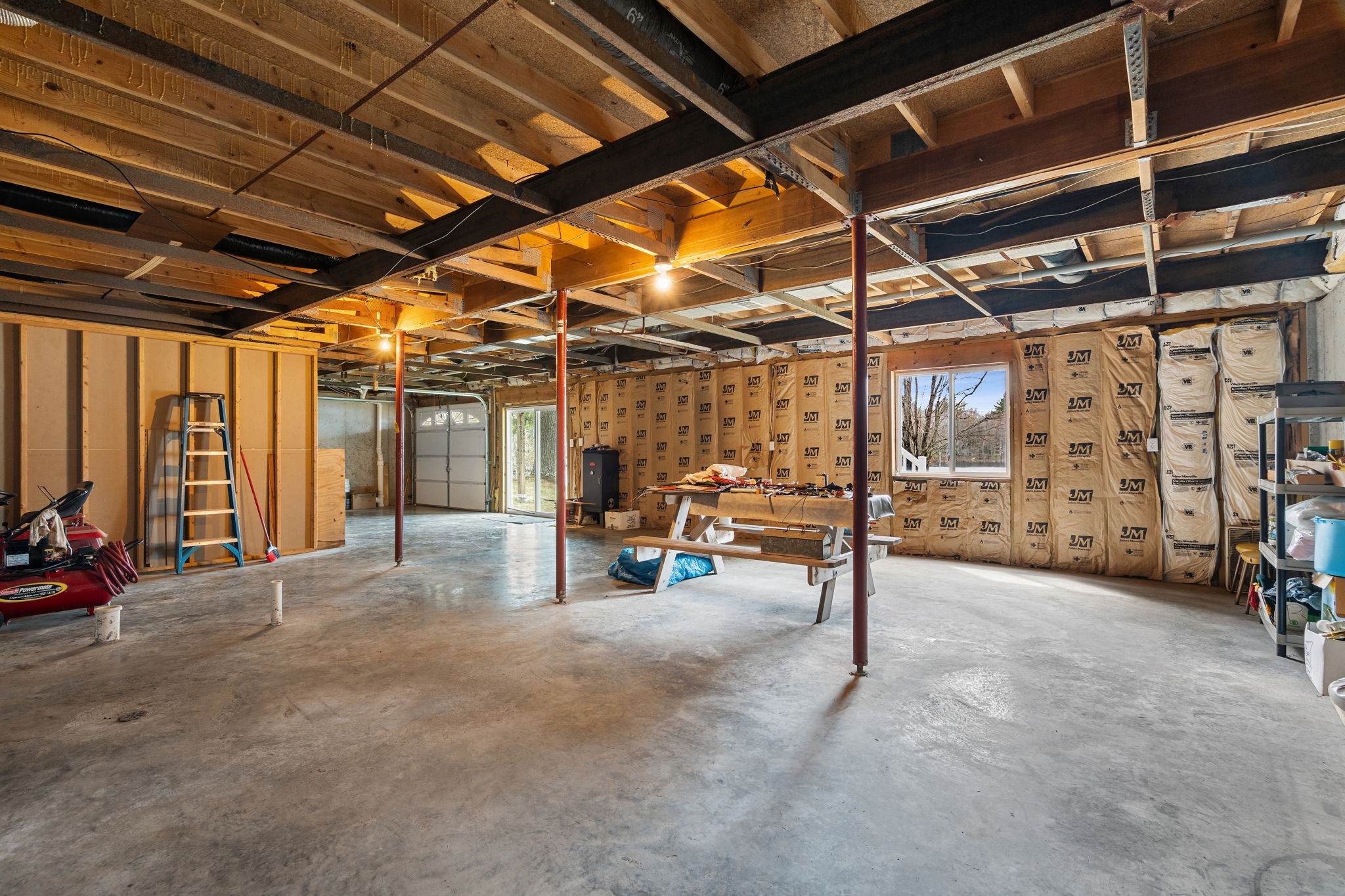 12503 Small Road Hayward, WI 54843 - Photo 35 of 36 Great supporting beams and poured concrete walls are ready to finish however you desire.