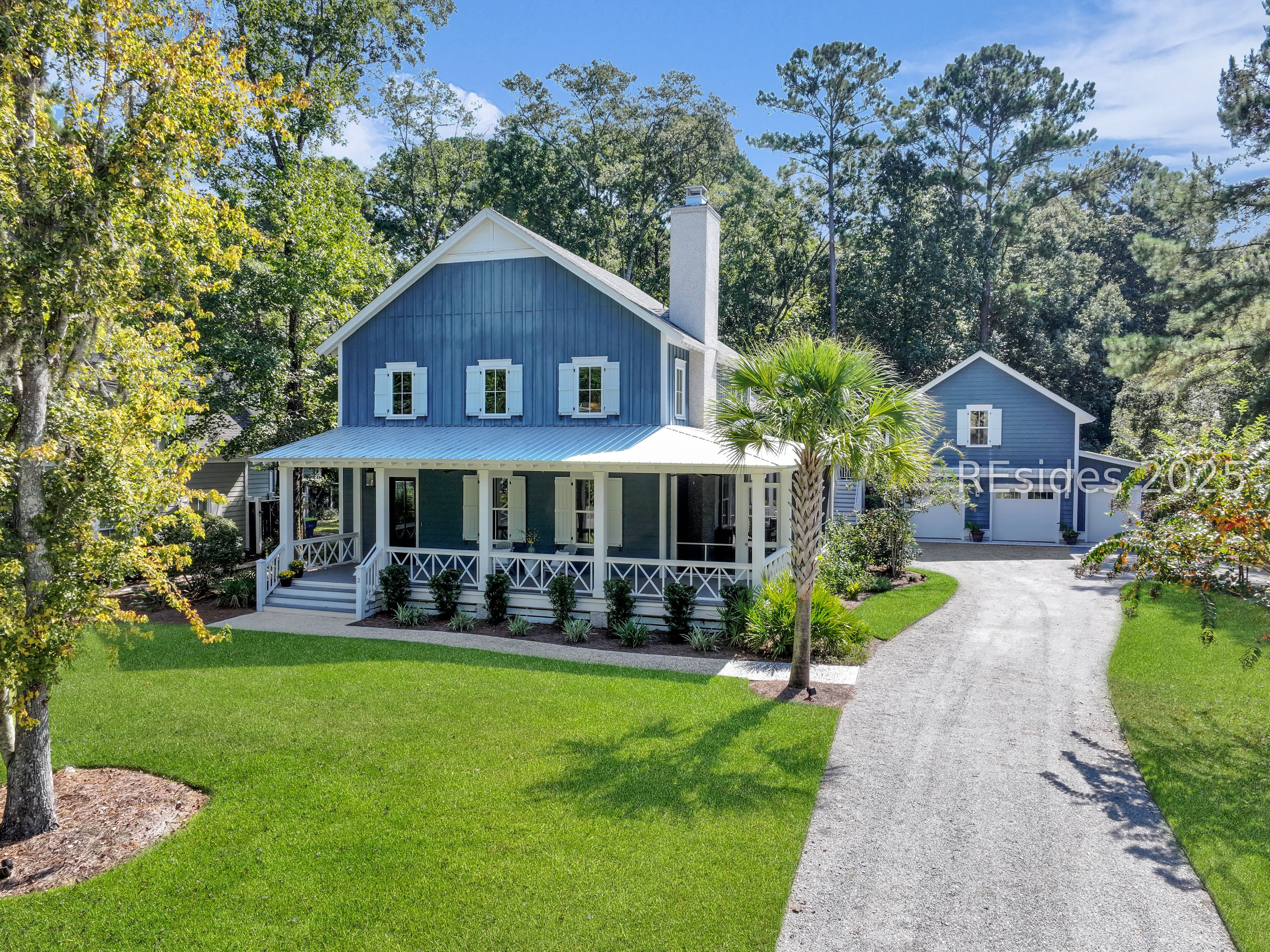 2 Oldfield Village Road Bluffton, SC 29909 - Photo 1 of 37 Tucked into the .53 acre lot, this home stands out