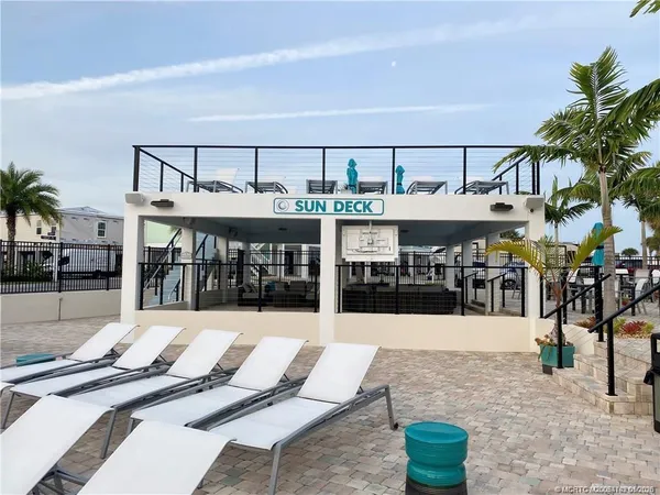 a view of a patio with a table and chairs