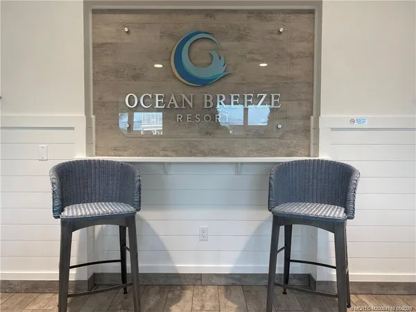 a view of a house with a wooden deck