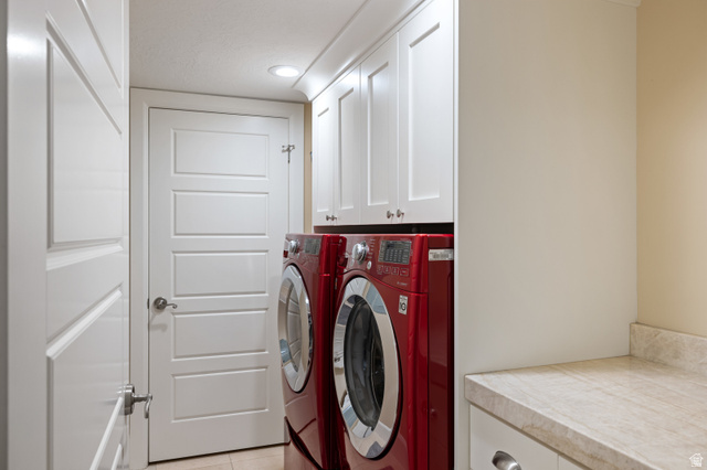 1263 Chapman Court Alpine, UT 84004 - Photo 55 of 83 Laundry room with independent washer and dryer, light tile patterned floors, and cabinet space