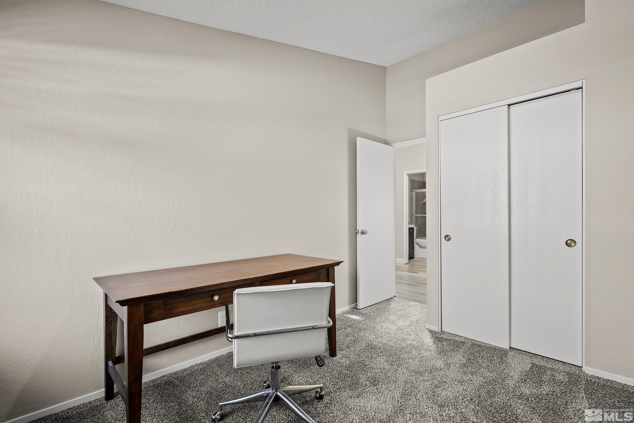 1306 Valley Creek Road Reno, NV 89523 - Photo 20 of 40 a room with a table and a chair