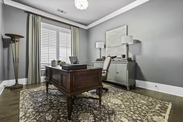 a spacious bedroom with a bed and a window