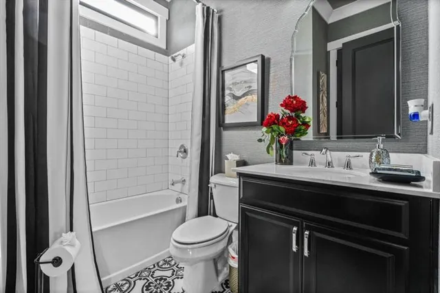 a bathroom with a sink a toilet and a bathtub