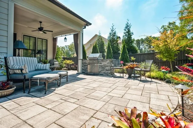 a view of a backyard with sitting area