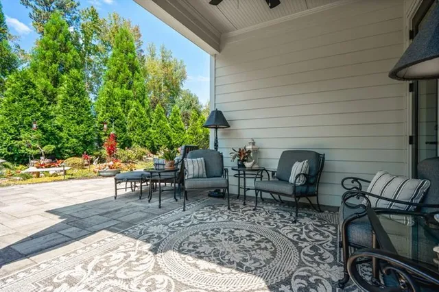 a front view of a house with a yard table and chairs