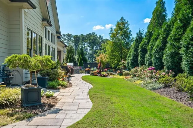 a front view of a house with garden