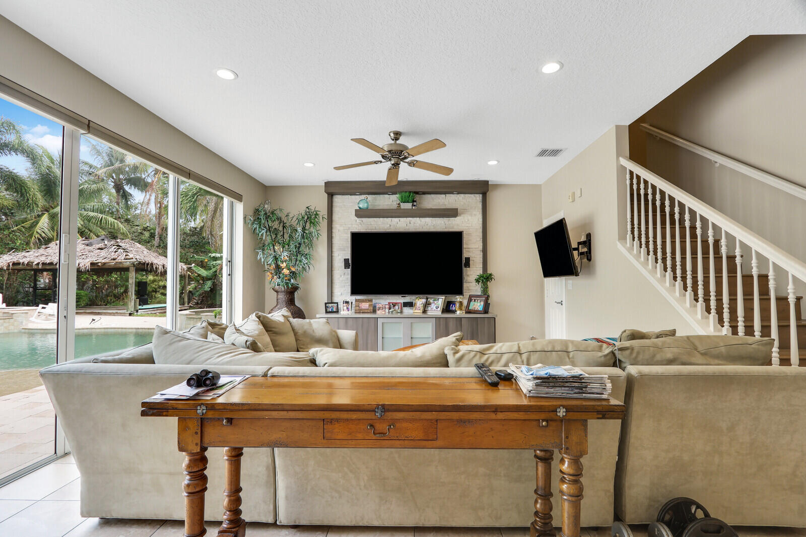 101 St Pierre Way Jupiter, FL 33458 - Photo 14 of 57 a dining room with furniture and a flat screen tv