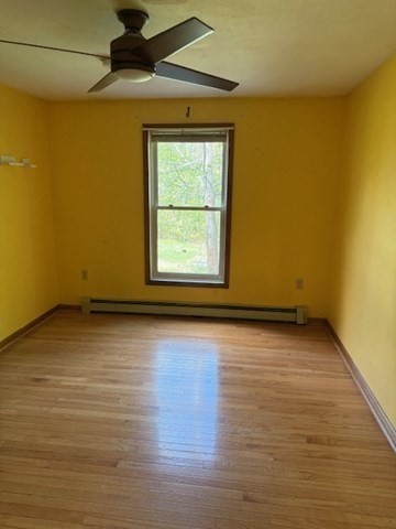 30 Groton Road Shirley, MA 01464 - Photo 11 of 25 an empty room with wooden floor and windows