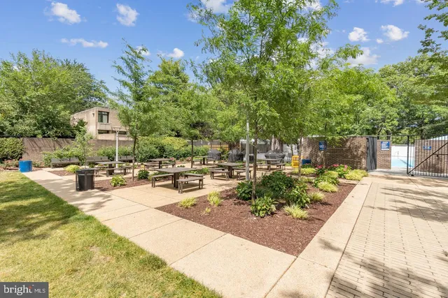 a view of a backyard with sitting area