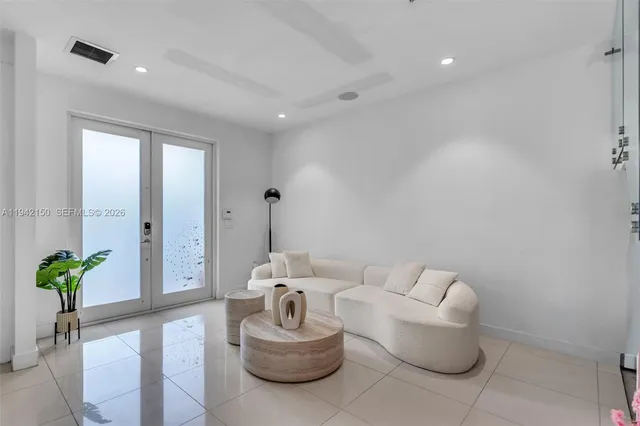 a view of a dining room with furniture wooden floor and chandelier