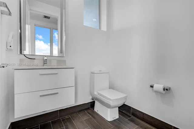 a bathroom with a double vanity sink window and a