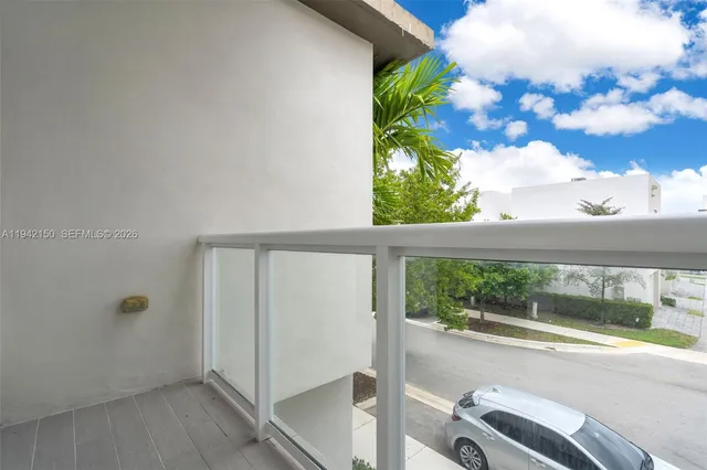 a bedroom with a bed a window and dresser