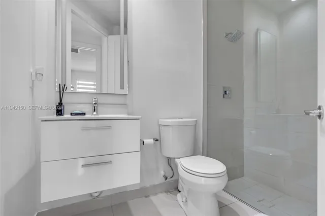 a kitchen with stainless steel appliances a sink a stove and a refrigerator