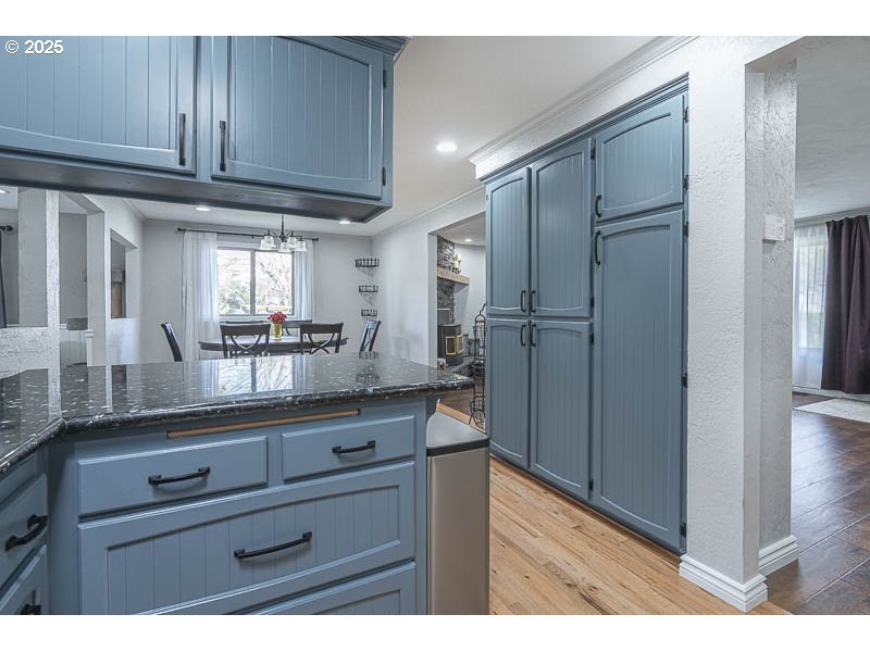 1216 Northeast Montgomery Place Albany, OR 97321 - Photo 14 of 47 a kitchen view with granite countertop cabinets and refrigerator
