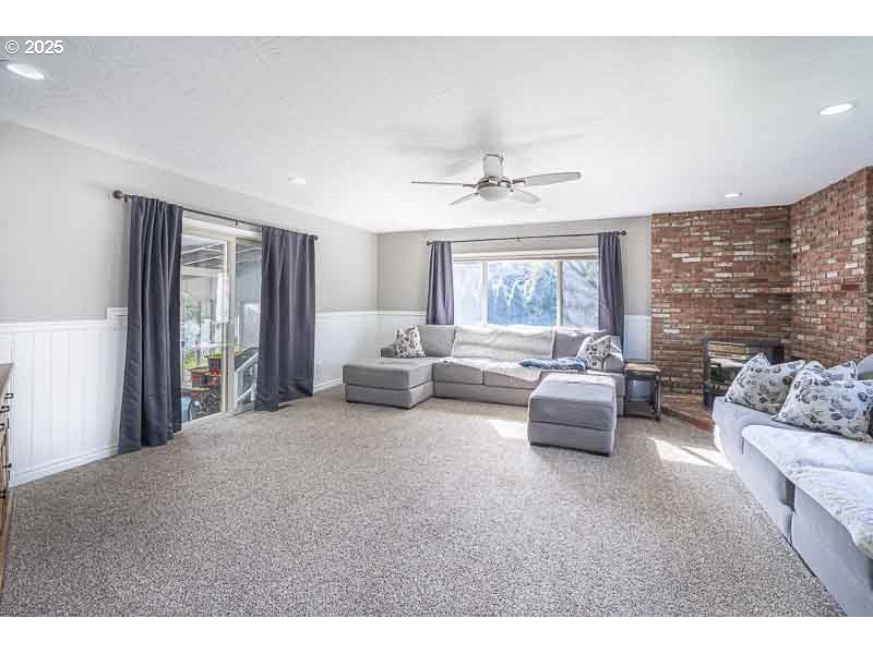 1216 Northeast Montgomery Place Albany, OR 97321 - Photo 16 of 47 a living room with furniture and a large window