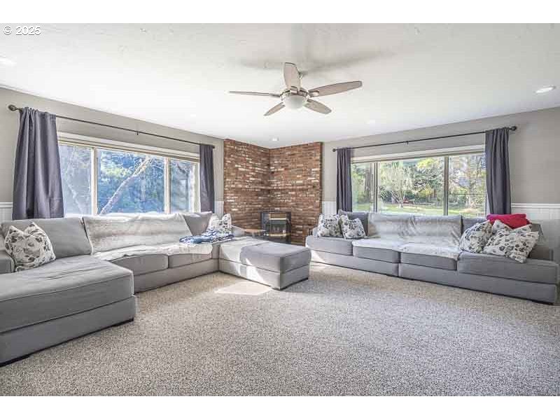 1216 Northeast Montgomery Place Albany, OR 97321 - Photo 17 of 47 a living room with furniture and a large window