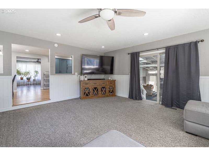 1216 Northeast Montgomery Place Albany, OR 97321 - Photo 19 of 47 a view of a livingroom with furniture a ceiling fan and front door