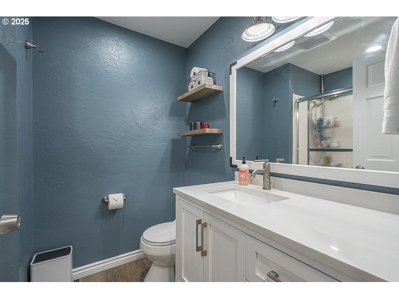 1216 Northeast Montgomery Place Albany, OR 97321 - Photo 20 of 47 a bathroom with a sink a toilet and a mirror