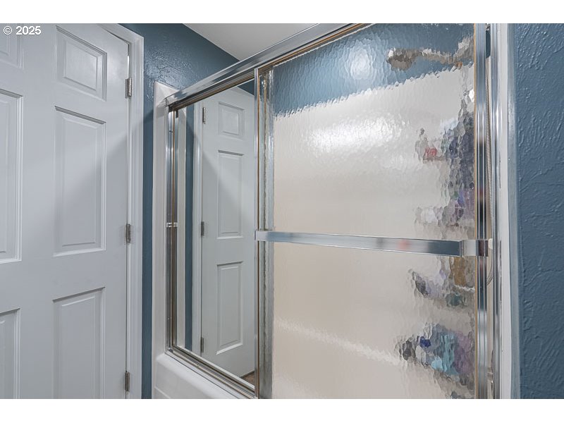 1216 Northeast Montgomery Place Albany, OR 97321 - Photo 21 of 47 a bathroom with a glass shower door