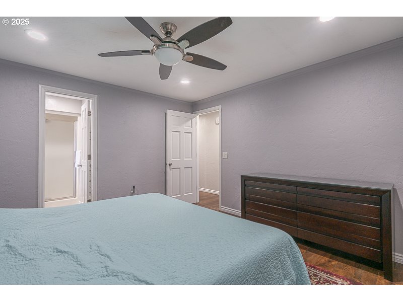 1216 Northeast Montgomery Place Albany, OR 97321 - Photo 23 of 47 a bedroom with a bed and a chandelier