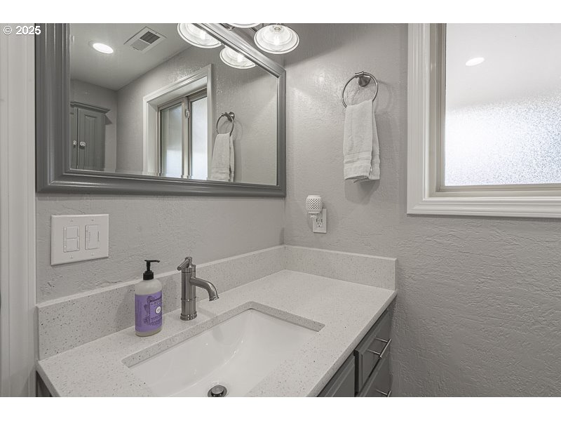 1216 Northeast Montgomery Place Albany, OR 97321 - Photo 29 of 47 a bathroom with a sink mirror and vanity