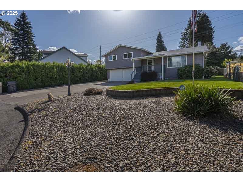 1216 Northeast Montgomery Place Albany, OR 97321 - Photo 3 of 47 a view of house with a yard and potted plants