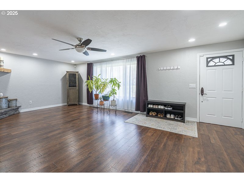 1216 Northeast Montgomery Place Albany, OR 97321 - Photo 9 of 47 a view of an empty room with window and wooden floor