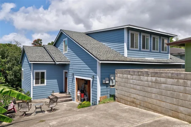 a front view of a house with garage