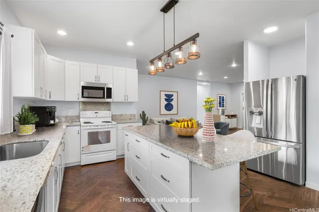 a kitchen with a sink dishwasher a stove a refrigerator cabinets and living room view