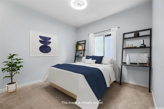 a bedroom with a bed and a potted plant